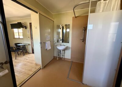 Bathroom of family cabin showing shower and sink.