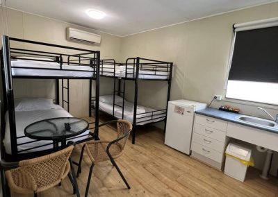 2 bunk beds and a kitchenette